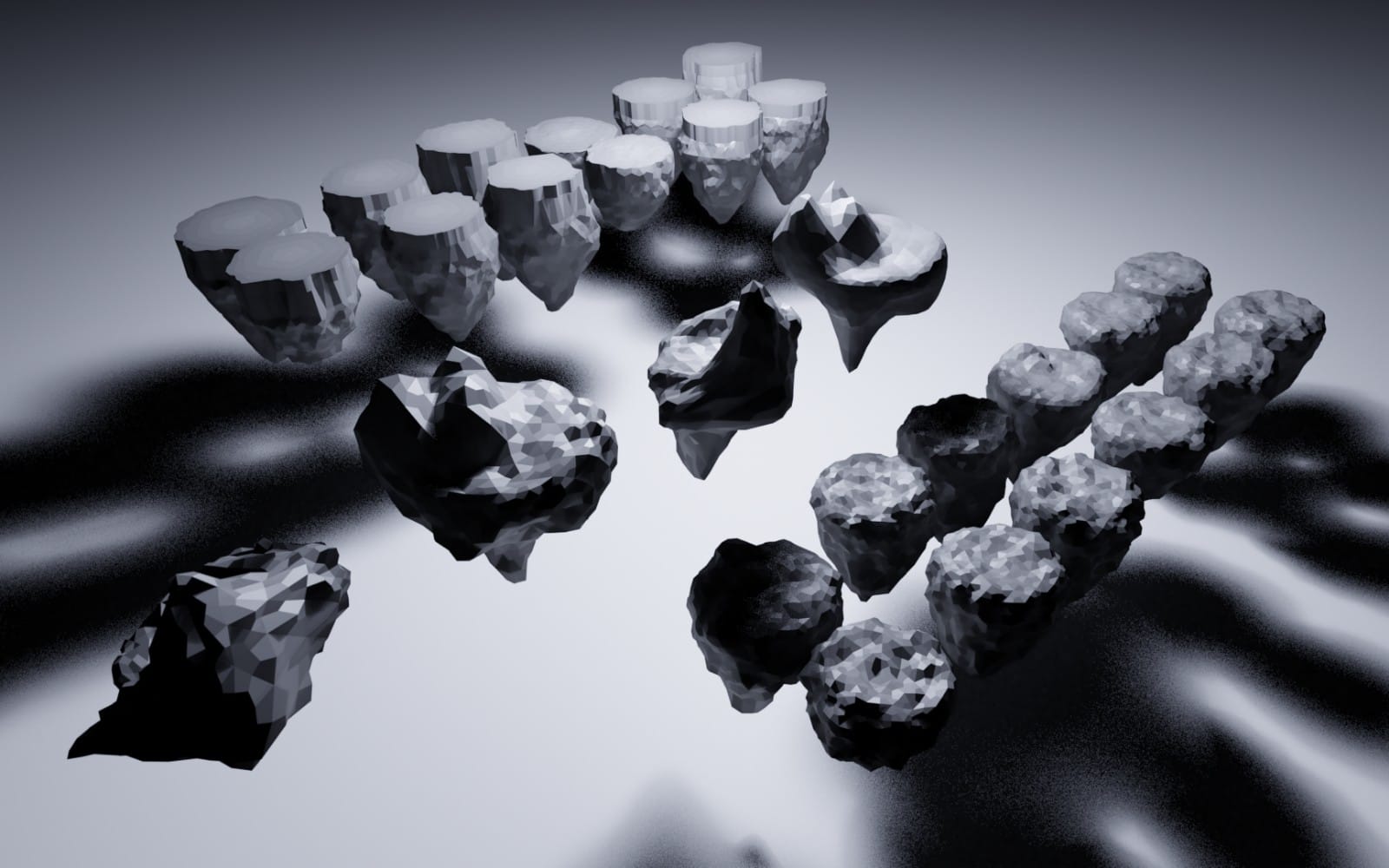 Floating rocks 3D asset collection with black and gray faceted stones on a soft foggy background
